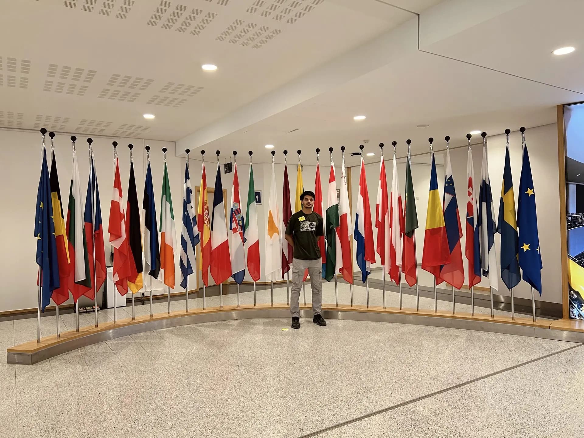 Founder Shahinsha standing in front of EU Parliament Belgium
